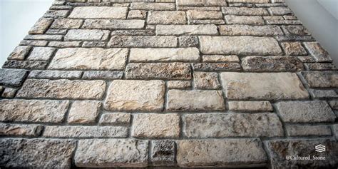 What is stone veneer made of, and how does it compare to the dreams of architects?